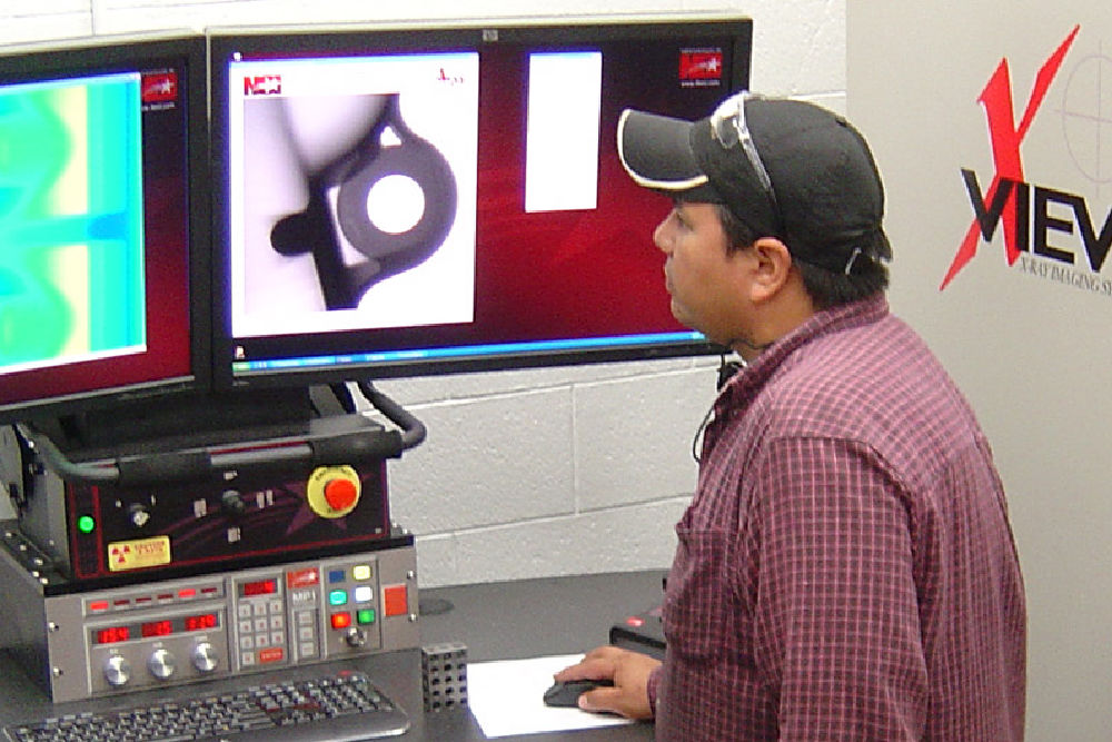 image of aluminum castings testing at Watry Industries aluminum foundry